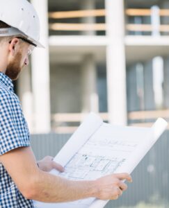 side-view-man-with-blueprint-min